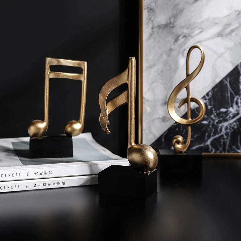 Estatuetas Decorativas de Notas Musicais em Resina Dourada